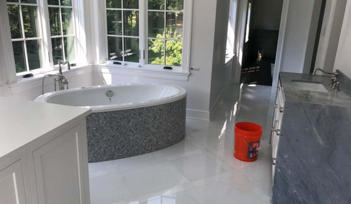 Ceramic Tiled Bathroom floor, bathtub with gray granite tiled sink area