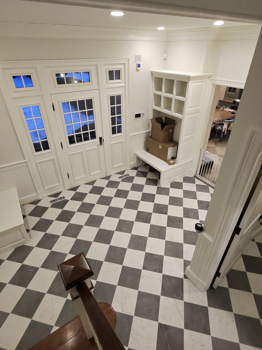 Checkerboard mudroom floor installation