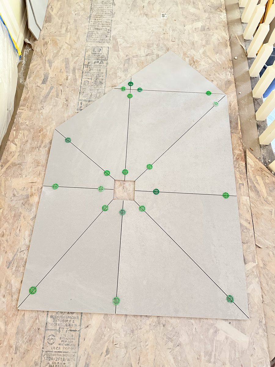 Custom tile layout template being set out