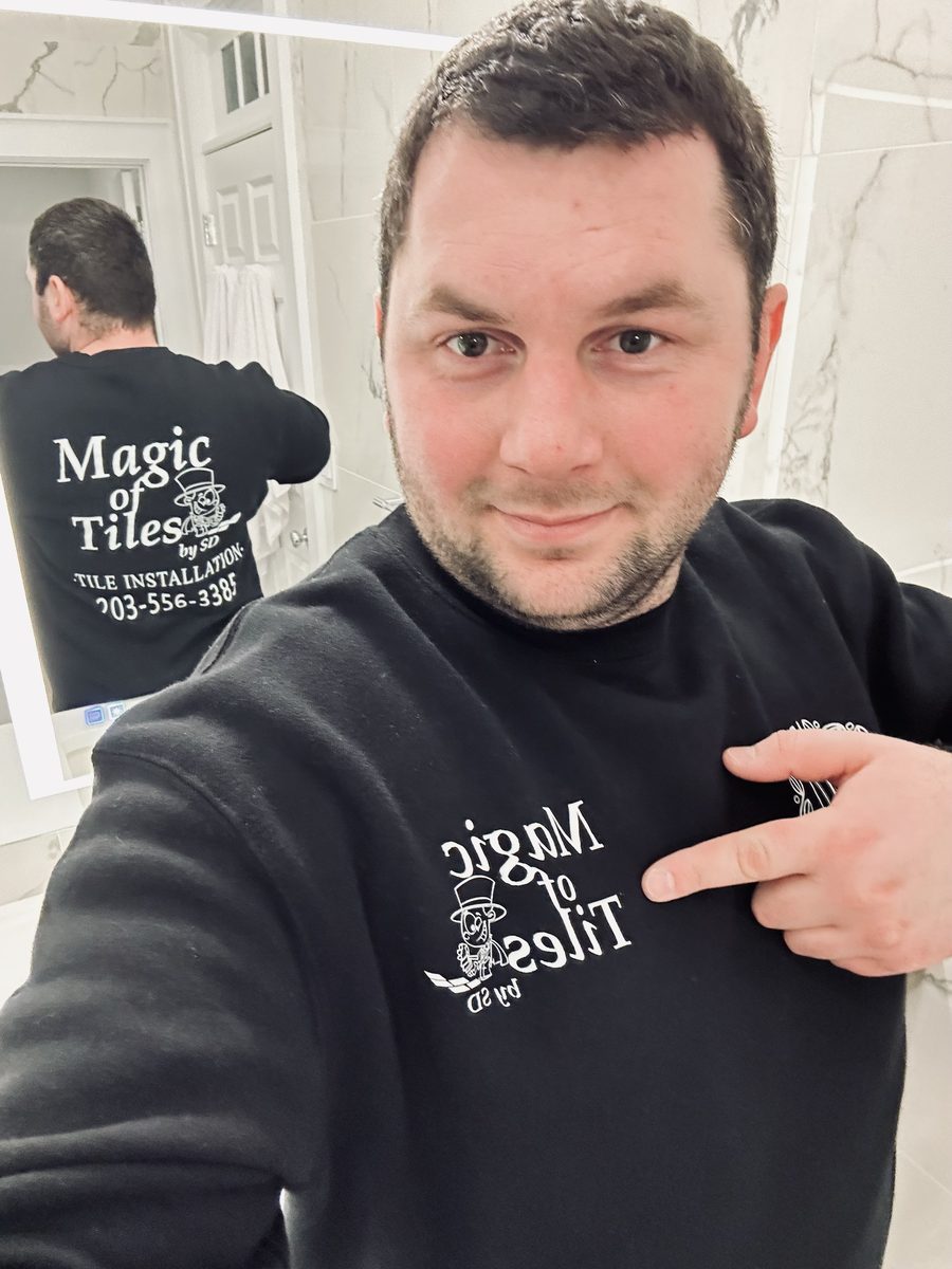 Magic of Tiles installer in branded company apparel