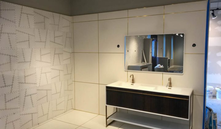 Bathroom Vanity Area Custom Tile Installed and illuminated by track spotlight